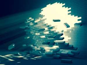 breakthrough depicted in a brick wall being broken open